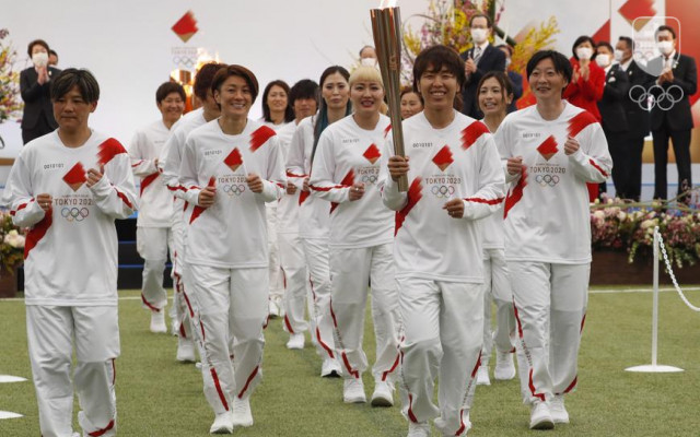 Momentka zo začiatku štafety s olympijským ohňom po japonskom území, ktorá odštartovala vo štvrtok vo Fukušime.