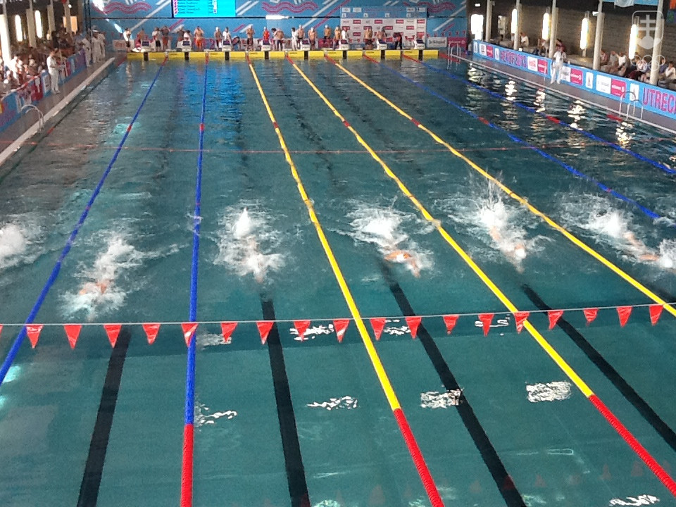 Plavci počas štafety 4x100 m v. sp. V nej Slováci neštartovali. FOTO: MOJMÍR GAŠKO